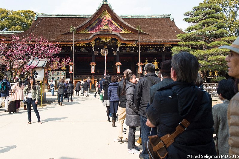 20150313_140339 D4S.jpg - Kitano Tenman-gu Shrine is a Shinto shrine built in 947.  There are long lines to toggle the bell. Kyoto